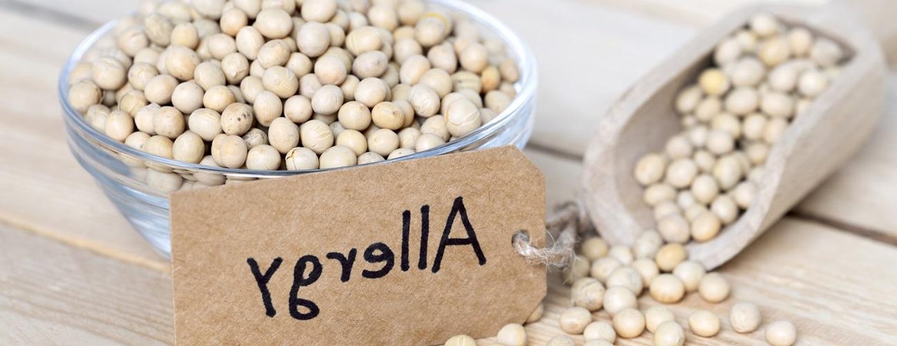 Bowl of soybeans labeled with an allergy sign