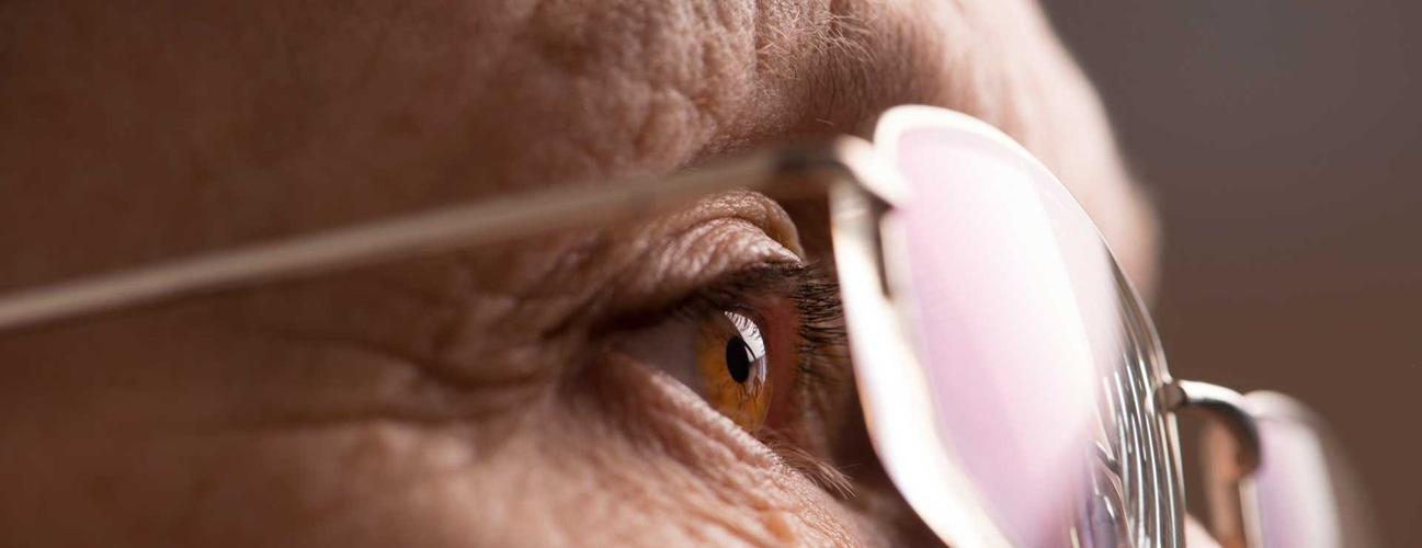 elderly woman eye with glasses