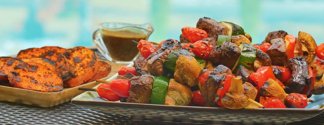 plate of balsamic steak skewers with mixed vegetables