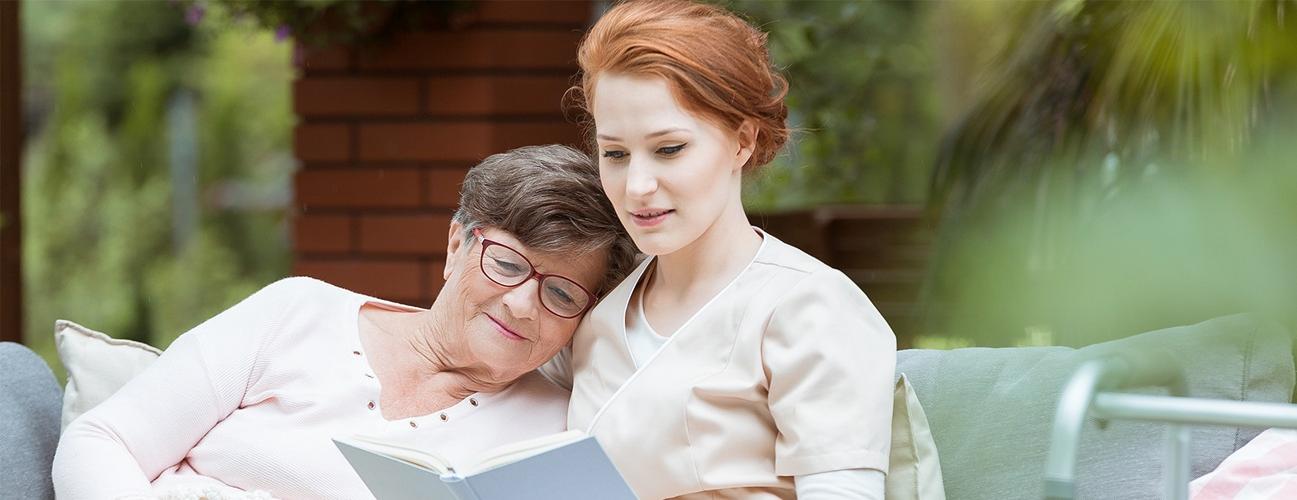 woman reading with caregiver