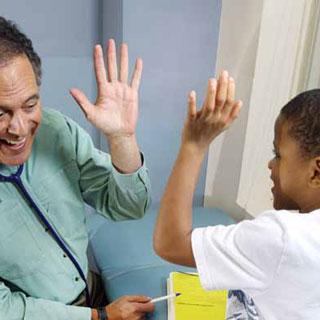 pediatrician Dan Levy with young patient