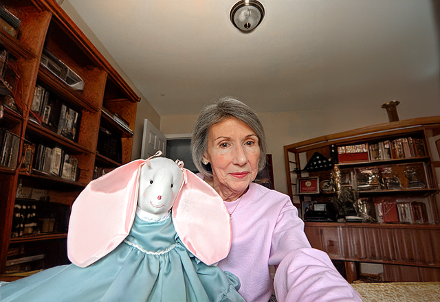 Kathleen holding a stuffed rabbit.